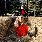 little girl on hay ride